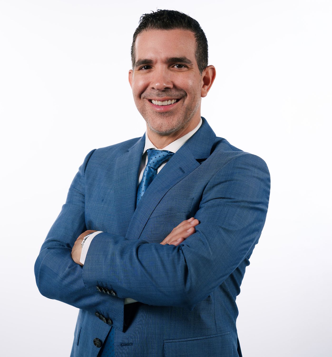 Smiling man in a suit against white background.